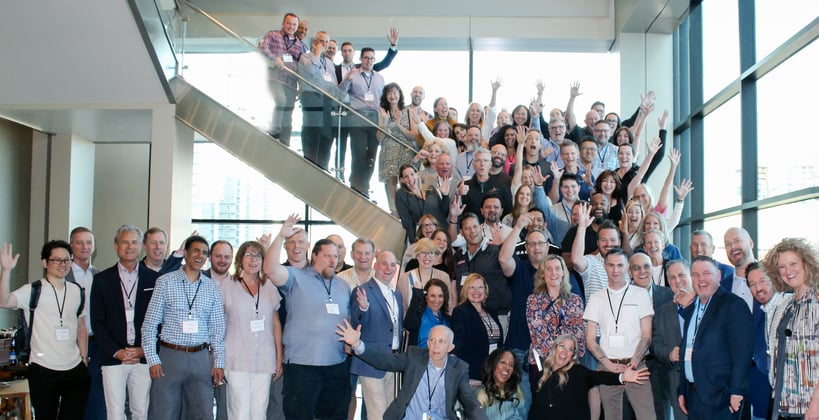 Group photo of Phoenix attendees standing on a stair case.